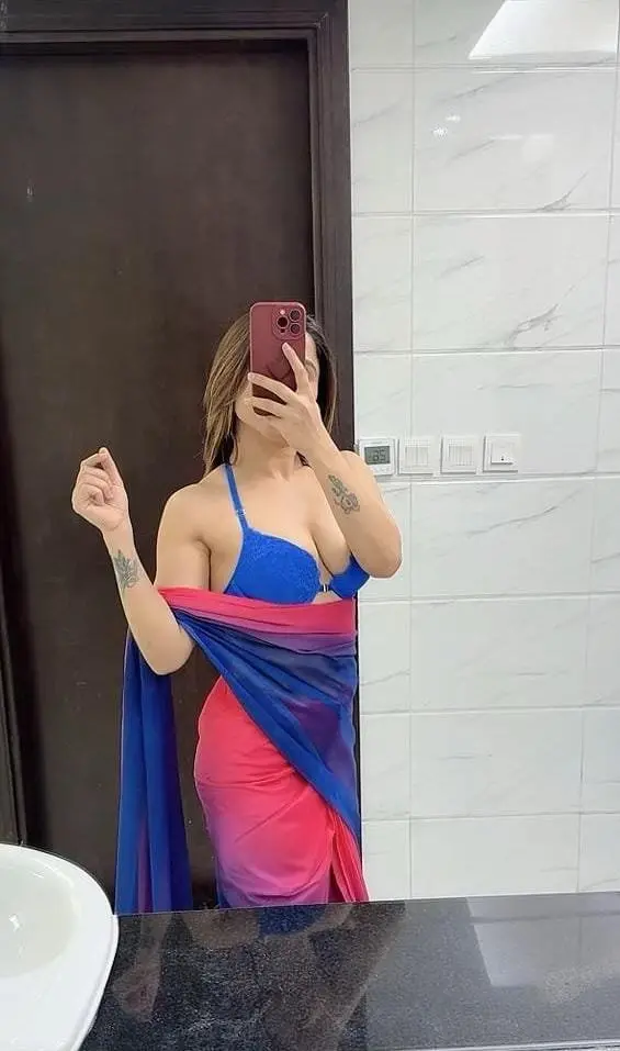 Aanya Indian escort profile on a Dubai Marina balcony