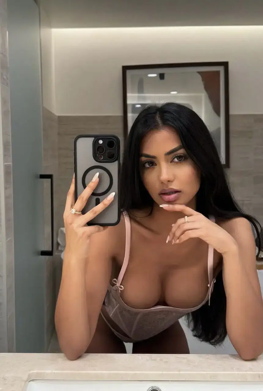 Jasmine Moroccan escort profile in a modern zellige chamber
