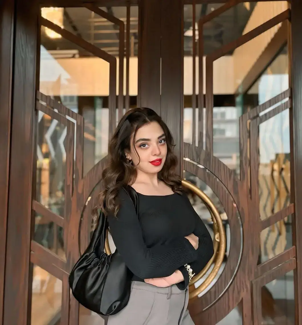 Komal Pakistani escort profile in a moonlit Dubai pavilion
